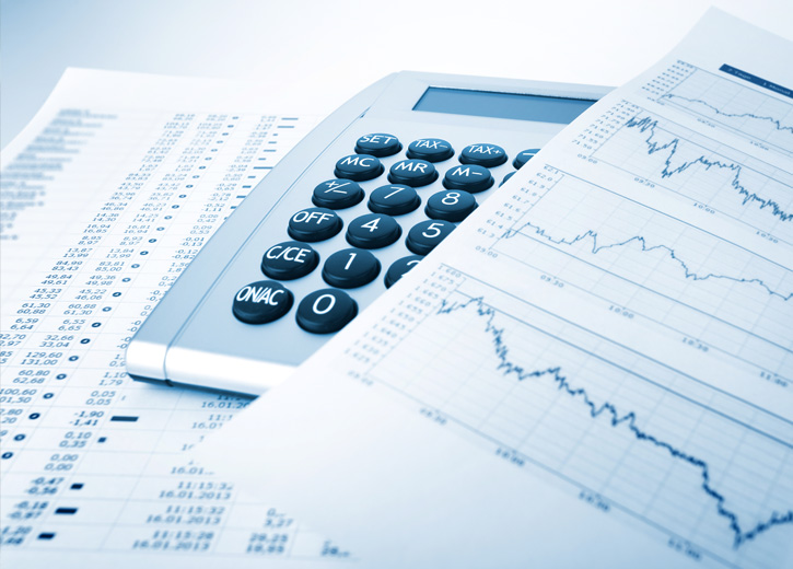 Tax papers covering a calculator